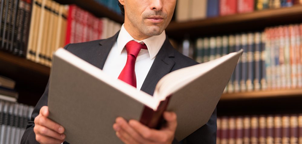 Lawyer Reading In Law Library